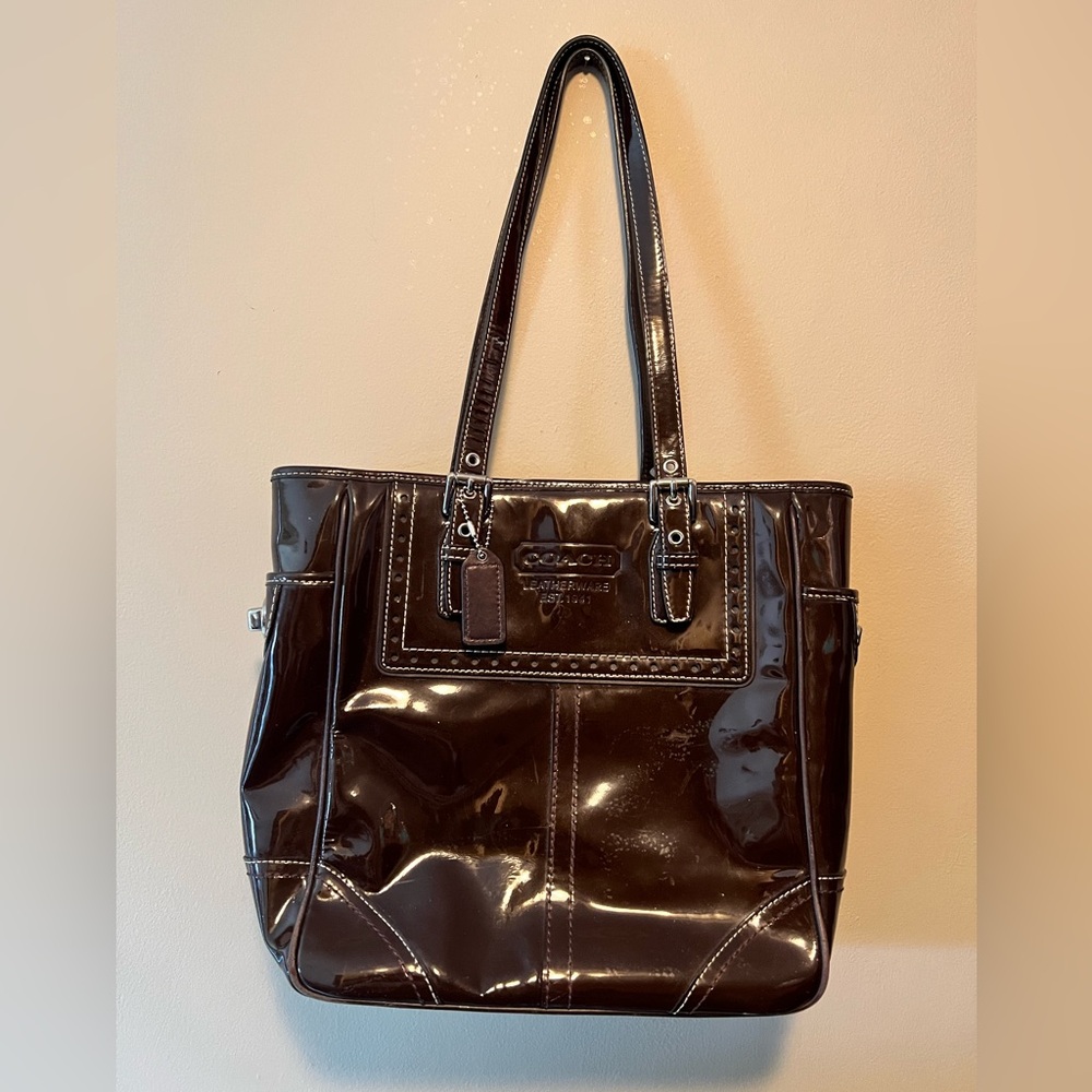 Coach brown patent leather tote. Silver hardware. See below for description.